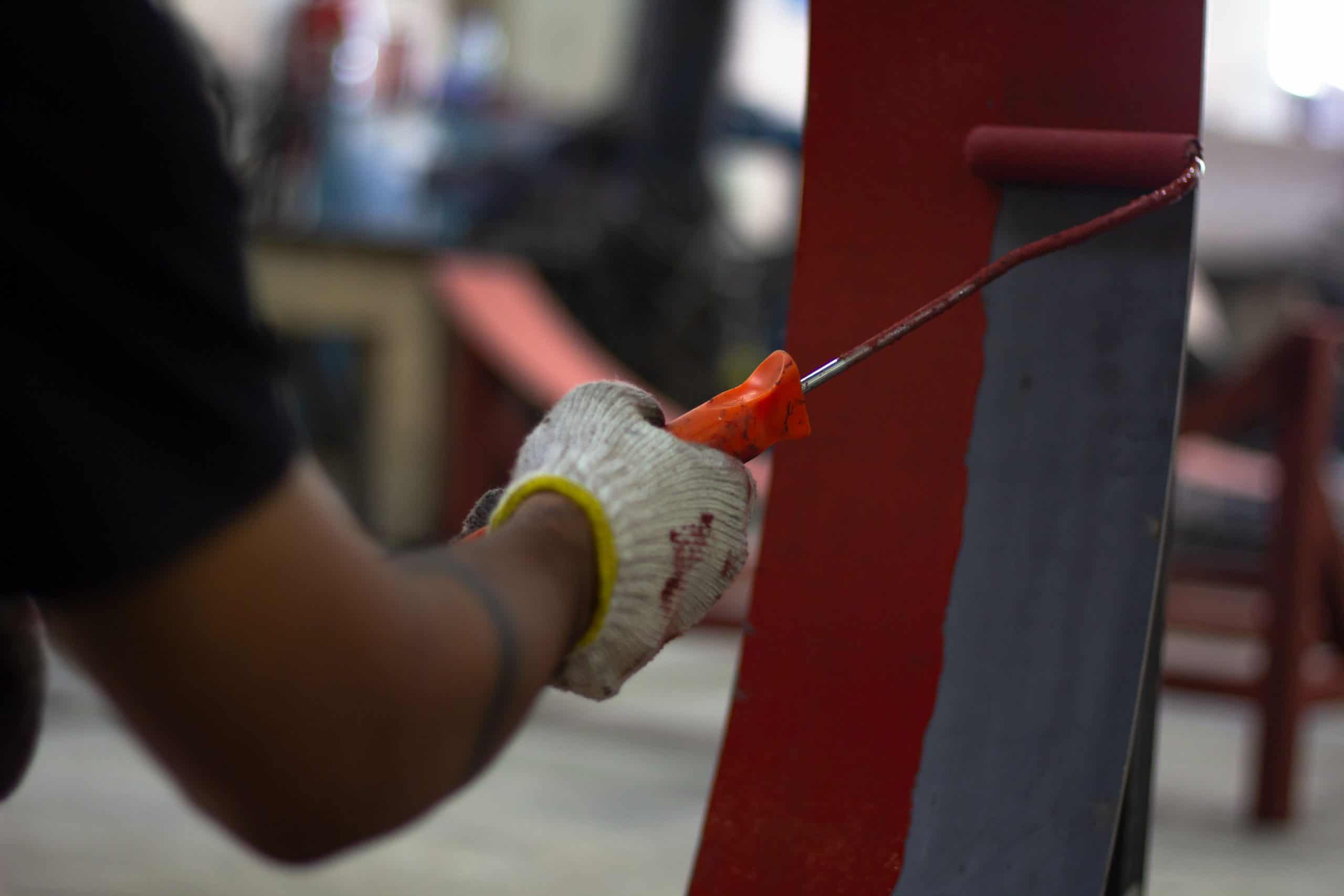Rust-Proof Painted Steel Pipes In The Factory. Red Iron Pipe