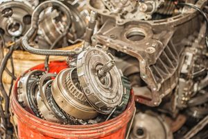 Bucket Of Used And Worn Out Automobile Parts Cleaned With Vpci®-418 Lm